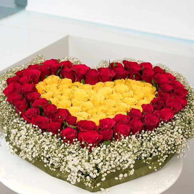 Heart-shaped Arrangement of Red & Yellow Roses Bouquet
